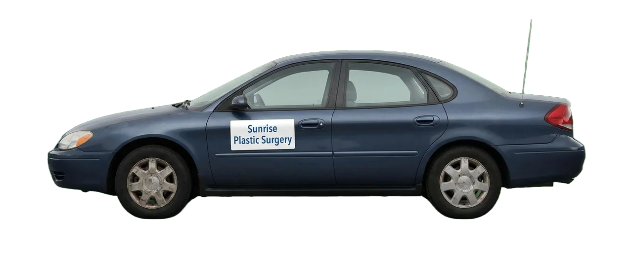 An older blue sedan with a magnetic 'Sunrise Plastic Surgery' sign on the door, the visual shorthand for marketing that's fine but isn't winning anymore